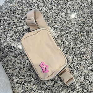 Beige Belt Bag with Pink Logo